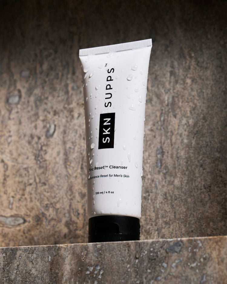 SKN SUPPS Zinc Reset face wash for men with zinc PCA on stone surface.