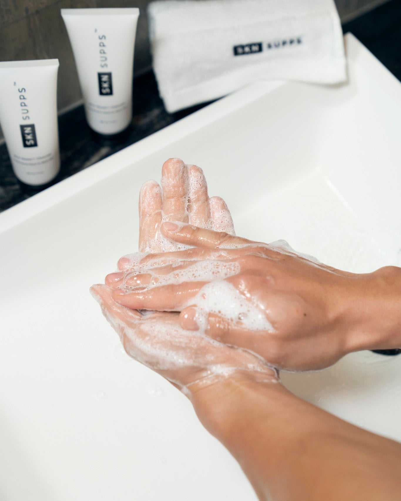 Man using SKN SUPPS Zinc Reset face wash for oily skin.